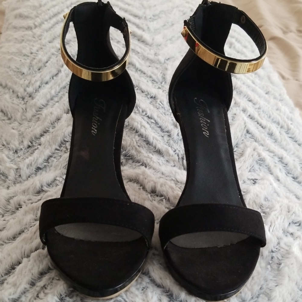 Black heels with gold ankle accent
